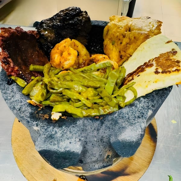 Coco Mexican Restaurant's molcajete with grilled meats, shrimp, nopales, and cheese.